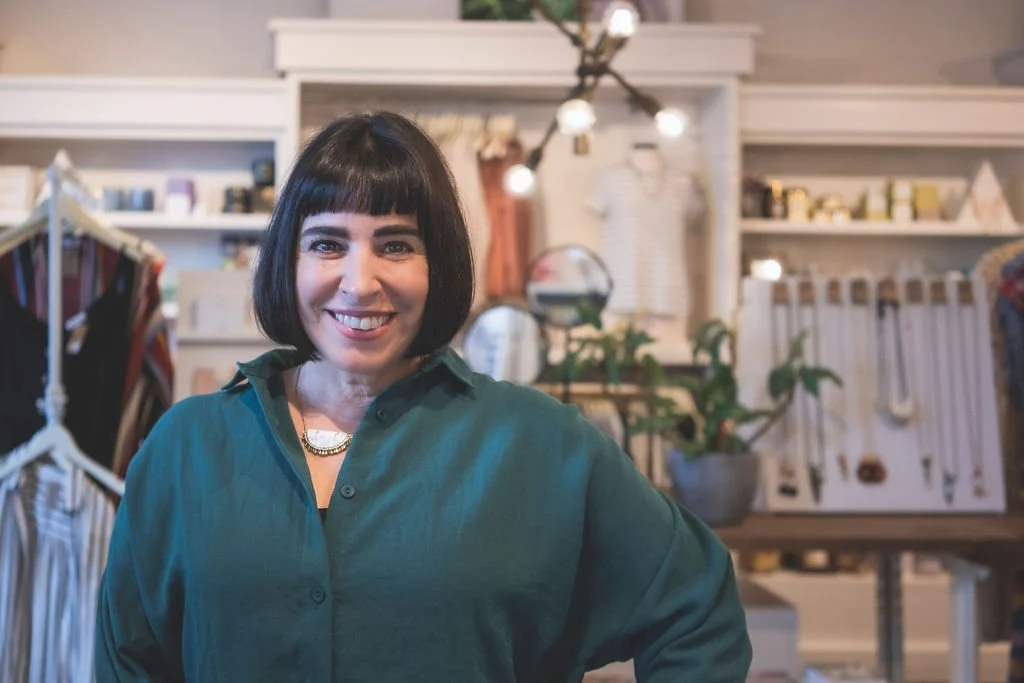 Rachel Williamson standing in a boutique, smiling